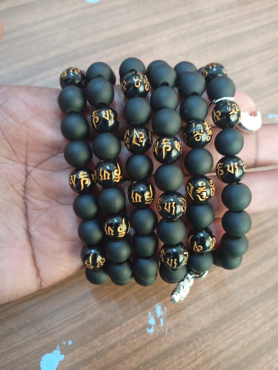 Black Matte Onyx Bracelet with Gold Mantra Beads